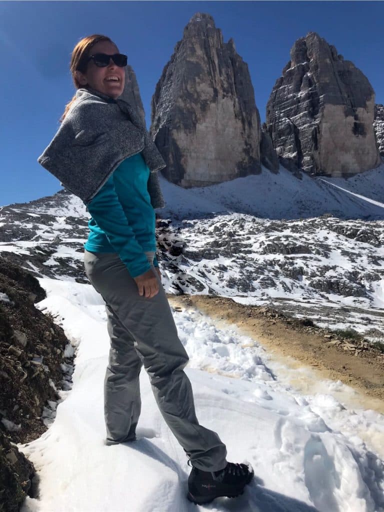 Inpsyde WordPress Engineer Carmen Maymo sanding in a snowy landscape