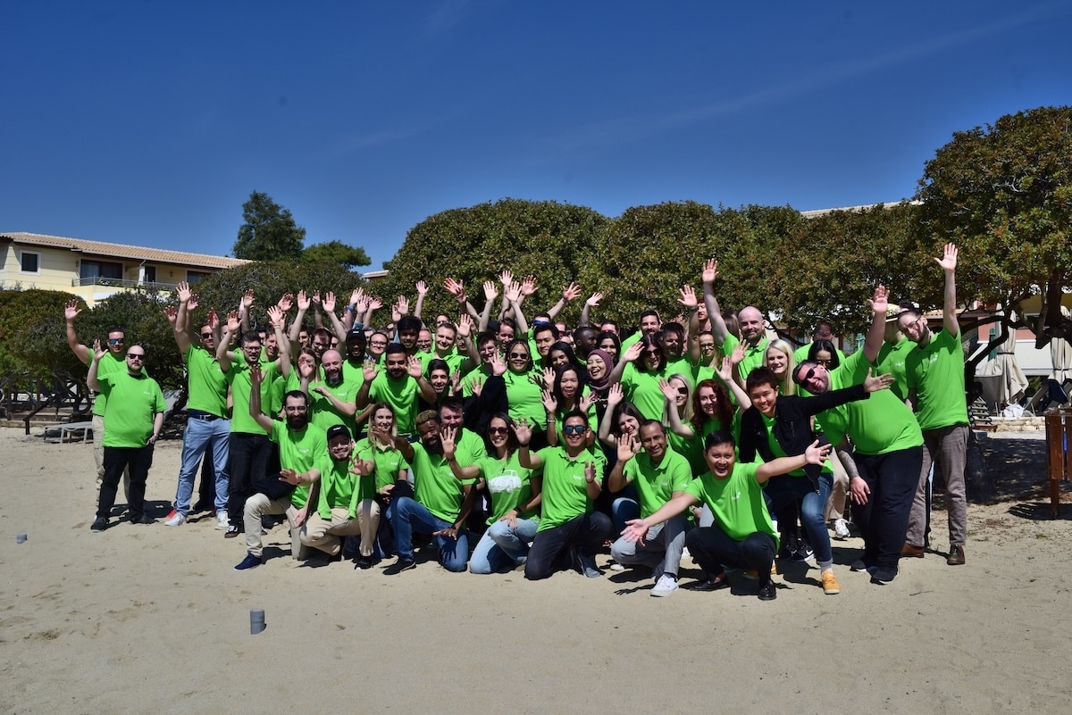 A group shot of all of the remote Syde employees on the beach in Greece.